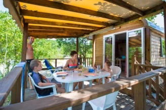 Camping Le Petit Bois 4*, Camping 4* à Ruoms (Ardèche) - Location Roulotte pour 4 personnes - Photo N°1